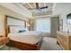 Bedroom suite featuring a decorative ceiling, ceiling fan and a large window at 5325 Marina Drive # 423, Holmes Beach, FL 34217