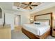 Well-lit bedroom featuring a decorative ceiling, ceiling fan and a king-sized bed at 5325 Marina Drive # 423, Holmes Beach, FL 34217