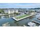 Drone shot of condo complex with luxurious waterfront living, docks, and beautiful landscaping at 5325 Marina Drive # 423, Holmes Beach, FL 34217