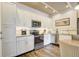 Modern kitchen featuring stainless steel appliances, granite countertops, and ample cabinet space at 5325 Marina Drive # 423, Holmes Beach, FL 34217