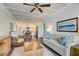 Comfortable living room seamlessly connects to the kitchen and dining area with neutral accents at 5325 Marina Drive # 423, Holmes Beach, FL 34217