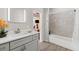 Bright bathroom with a vanity and a shower/tub combination at 5442 Kent Rd, Venice, FL 34293