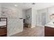 Elegant bathroom featuring a tiled shower, wood-look floors, and a neutral color scheme at 5442 Kent Rd, Venice, FL 34293