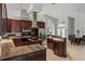 Spacious kitchen with an island, stainless steel appliances, and custom wood cabinets offering ample storage at 5442 Kent Rd, Venice, FL 34293