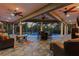 Well appointed lanai provides ample space for entertaining with views of the pool and outdoor kitchen at 5442 Kent Rd, Venice, FL 34293