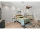 Bright bedroom features wood-look flooring, a ceiling fan, and views from plentiful recessed lights at 5442 Kent Rd, Venice, FL 34293