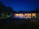 Stunning screened-in pool is illuminated at night and accessible from multiple rooms at 5442 Kent Rd, Venice, FL 34293