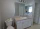 This bathroom features a spacious vanity and linen closet at 5578 Thyer St, North Port, FL 34288