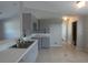 This kitchen features sleek gray cabinets and tile flooring at 5578 Thyer St, North Port, FL 34288