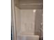 White shower and tub combo with sliding door at 5578 Thyer St, North Port, FL 34288