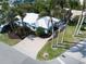 Overhead view of a single Gathering home with mature tropical landscaping and circular driveway at 5608 Holmes Blvd, Holmes Beach, FL 34217