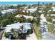 Coastal home nestled among lush tropical greenery, walking distance from the white sands of the beach at 5608 Holmes Blvd, Holmes Beach, FL 34217