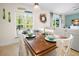 Dining room features large window bringing in ample natural light adjacent to living area at 5608 Holmes Blvd, Holmes Beach, FL 34217