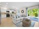 Open living space with modern decor, white kitchen, and sliding glass doors to the pool at 5608 Holmes Blvd, Holmes Beach, FL 34217