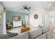 Inviting living room with cozy seating, a TV, and easy access to the outdoors at 5608 Holmes Blvd, Holmes Beach, FL 34217