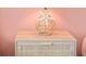 Close-up of nightstand with starfish decor and rattan drawer at 5608 Holmes Blvd, Holmes Beach, FL 34217