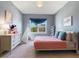 Cozy bedroom featuring a comfortable bed, dresser, and a teepee at 5742 Hydrangea Cir, Sarasota, FL 34238