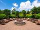 Inviting fire pit area surrounded by comfortable seating, providing a cozy outdoor gathering space for residents at 5742 Hydrangea Cir, Sarasota, FL 34238