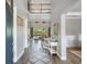 Welcoming foyer with a two-story entrance and an elegant staircase leading to the upper level at 5742 Hydrangea Cir, Sarasota, FL 34238