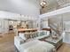 Open-concept living space with high ceilings and a seamless flow into the kitchen at 5742 Hydrangea Cir, Sarasota, FL 34238