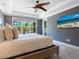 Comfortable main bedroom featuring a king-size bed, soft carpeting, and ample natural light at 5742 Hydrangea Cir, Sarasota, FL 34238