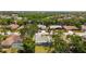 An aerial view shows the property's mature trees and proximity to other homes at 5810 42Nd E St, Bradenton, FL 34203