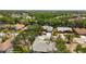 An aerial view highlights the property's location in a tree-lined residential area at 5810 42Nd E St, Bradenton, FL 34203