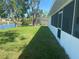 Screened-in lanai and backyard view with a glimpse of the canal, offering outdoor living and relaxation at 5810 42Nd E St, Bradenton, FL 34203