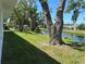 Enjoy a lush backyard with canal views and mature trees, offering a serene outdoor space at 5810 42Nd E St, Bradenton, FL 34203