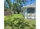 Well-maintained yard with lush grass and tasteful landscaping, enhancing the home's curb appeal at 5810 42Nd E St, Bradenton, FL 34203