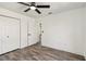 Bright bedroom featuring modern ceiling fan, wood-look tile flooring, and a closet at 5810 42Nd E St, Bradenton, FL 34203