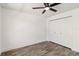 Neat bedroom featuring wood-look tile flooring, and a double-door closet at 5810 42Nd E St, Bradenton, FL 34203