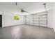 Spacious two car garage featuring sealed flooring, windows, and an automatic door at 5810 42Nd E St, Bradenton, FL 34203
