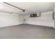 Spacious garage featuring sealed concrete flooring and updated mechanics at 5810 42Nd E St, Bradenton, FL 34203