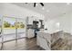 Modern kitchen with an island, stainless steel appliances, and views of the backyard at 5810 42Nd E St, Bradenton, FL 34203