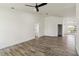 Open-concept living room with wood-look floors and high ceilings, providing ample space for comfortable living at 5810 42Nd E St, Bradenton, FL 34203