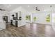 Open concept living room with tile floors and sliding doors to the outdoor space at 5810 42Nd E St, Bradenton, FL 34203