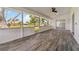 Screened lanai with tile flooring and a large view of the backyard and neighborhood at 5810 42Nd E St, Bradenton, FL 34203