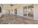 Tile floored screened lanai with multiple sliding glass doors and a ceiling fan at 5810 42Nd E St, Bradenton, FL 34203