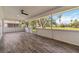 Screened lanai with tile flooring with an expansive view of the backyard at 5810 42Nd E St, Bradenton, FL 34203