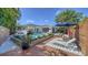 Stunning backyard featuring a pool, patio, hot tub, wooden deck, mature landscaping, and privacy fence at 5856 Meriwether Pl, Sarasota, FL 34232