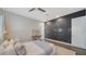 Comfortable bedroom with desk, ceiling fan and unique wall feature at 5856 Meriwether Pl, Sarasota, FL 34232