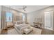 Spacious bedroom featuring stylish decor, wood floors, and ceiling fan at 5856 Meriwether Pl, Sarasota, FL 34232