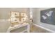 Bright entryway with stylish decor, wood-look floors, and serene artwork on the walls at 5856 Meriwether Pl, Sarasota, FL 34232
