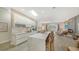 Open layout with large island and seating, with a view of the outdoor living area, perfect for entertaining at 5856 Meriwether Pl, Sarasota, FL 34232