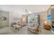 Bright living room features a modern fireplace, skylight, and access to the outdoor living area at 5856 Meriwether Pl, Sarasota, FL 34232
