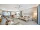 Open-concept living space with a modern kitchen, dining area, and a comfortable living room at 5856 Meriwether Pl, Sarasota, FL 34232