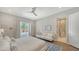 Bright main bedroom with a full-length mirror, ensuite access and a patio overlooking the pool at 5856 Meriwether Pl, Sarasota, FL 34232