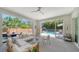 Enclosed outdoor living space with comfortable seating and a view of the private swimming pool at 5856 Meriwether Pl, Sarasota, FL 34232