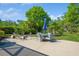 Backyard featuring an outdoor seating area with a table, chairs, and landscaping at 622 147Th E St, Bradenton, FL 34212